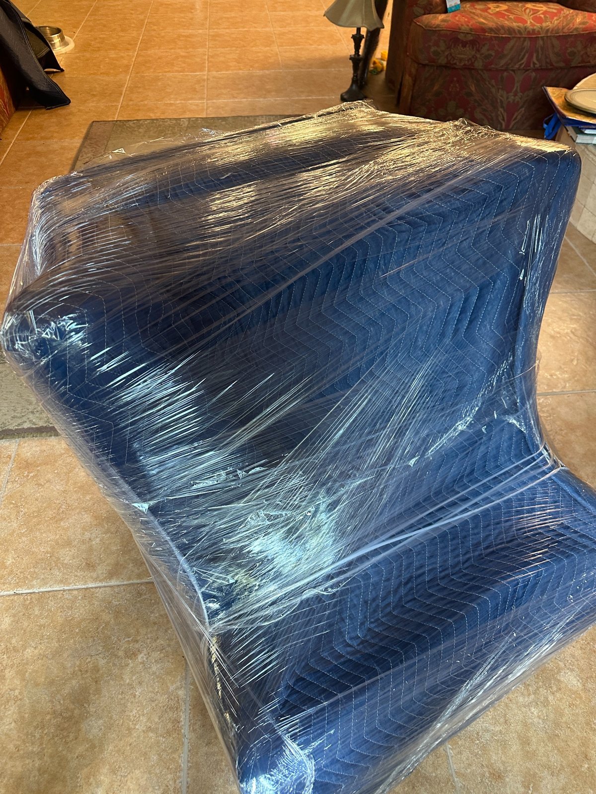 A piece of furniture carefully wrapped and protected for moving