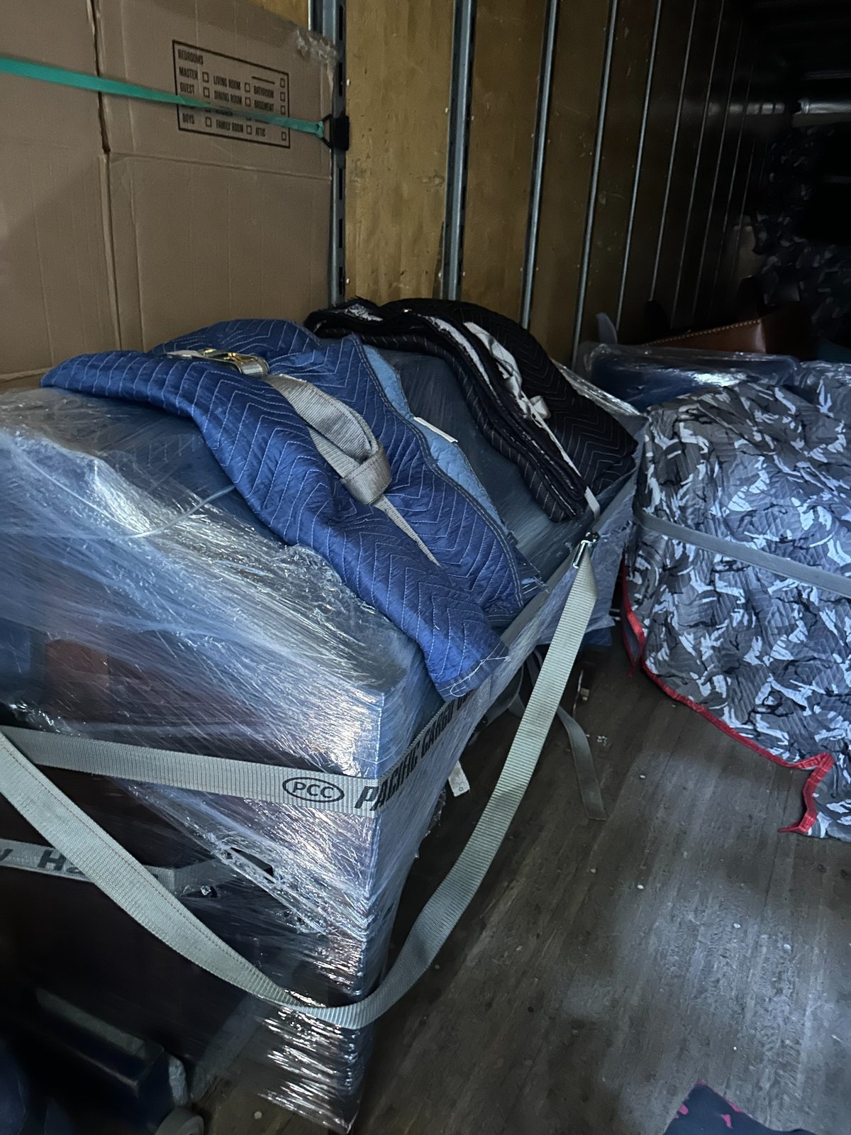 Carefully wrapped and secured belongings loaded for transport